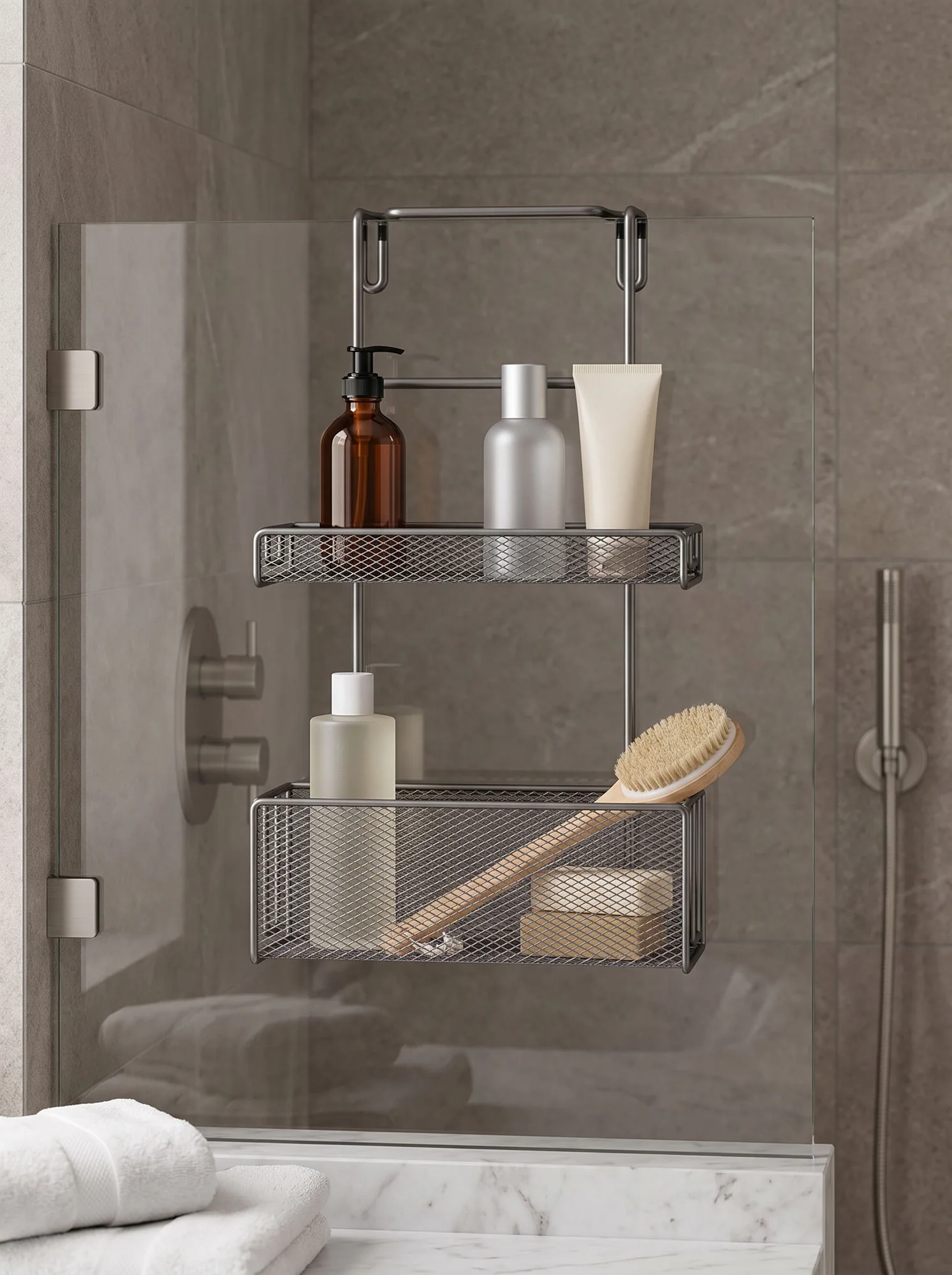 The caddy hooked over a glass shower screen, holding bottles and a brush